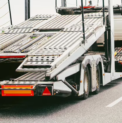 Car transporter with empty loading decks on the highway